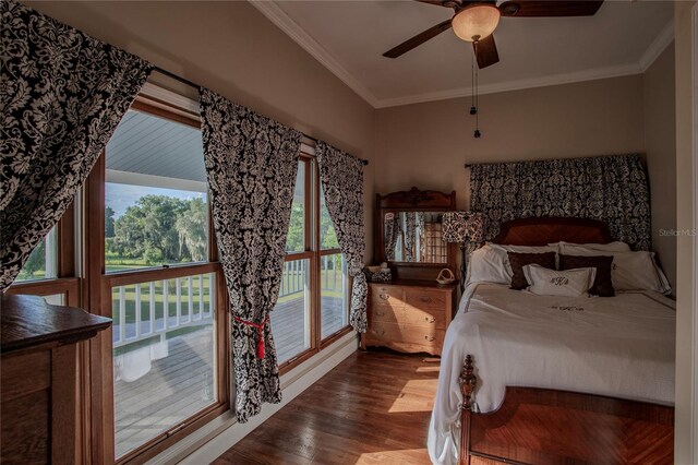 bedroom with crown molding, hardwood / wood-style floors, and ceiling fan