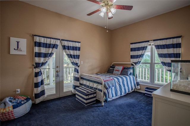 bedroom featuring french doors, ceiling fan, dark carpet, and access to outside