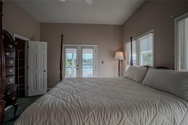 carpeted bedroom with french doors, ceiling fan, lofted ceiling, and access to exterior