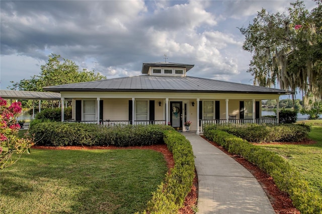 view of front of house with a porch and a front lawn