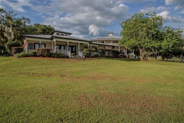 exterior space featuring a porch and a front lawn