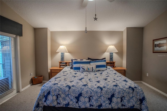 bedroom with carpet floors, a textured ceiling, and ceiling fan