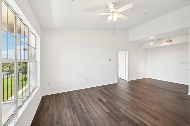 unfurnished room with track lighting, wood-type flooring, ceiling fan, and a healthy amount of sunlight