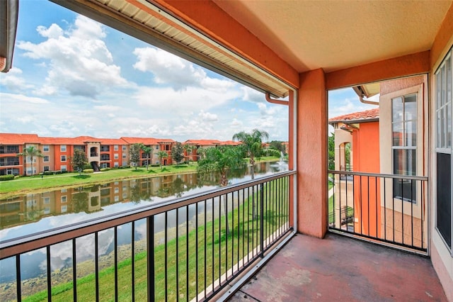 balcony featuring a water view