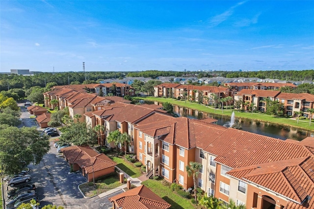 drone / aerial view featuring a residential view and a water view