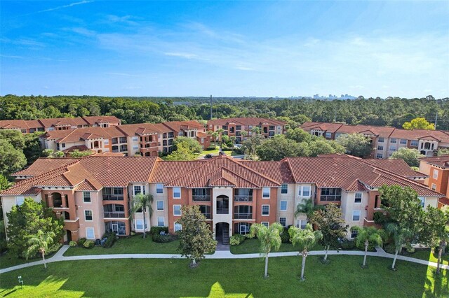 birds eye view of property with a residential view