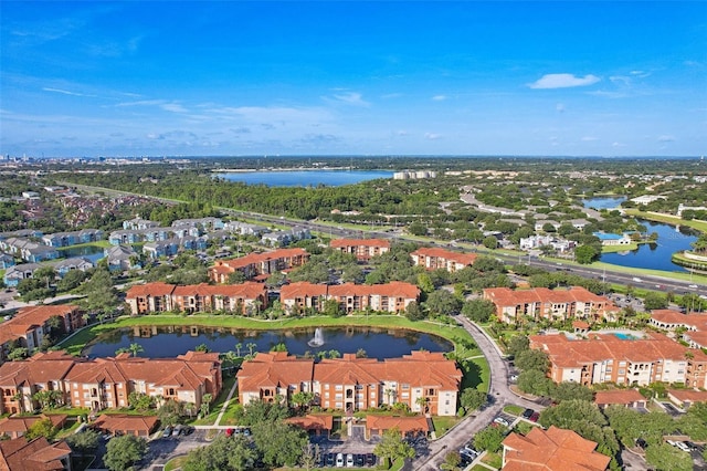 birds eye view of property with a residential view and a water view