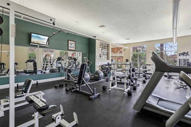 exercise room with a textured ceiling