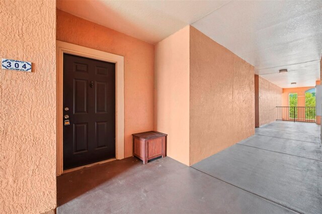 5536 Metrowest Blvd Unit 8-304, Orlando, FL 32811 - view of exterior entry with stucco siding