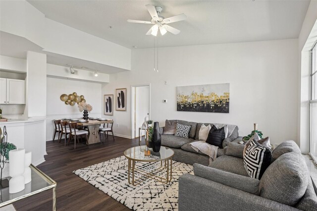 5536 Metrowest Blvd Unit 8-304, Orlando, FL 32811 - living area featuring dark wood finished floors, ceiling fan, track lighting, and baseboards