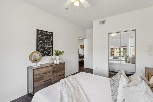 5536 Metrowest Blvd Unit 8-304, Orlando, FL 32811 - bedroom featuring dark wood-style flooring, baseboards, and ceiling fan