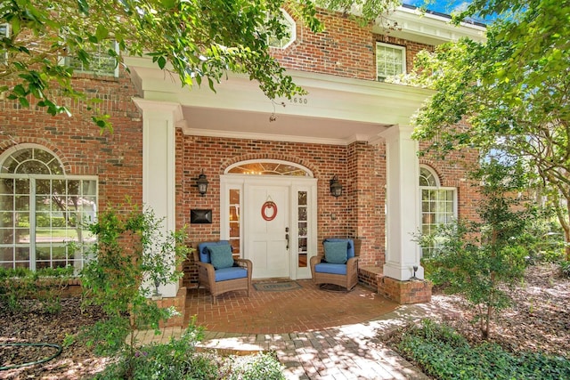 entrance to property with a patio