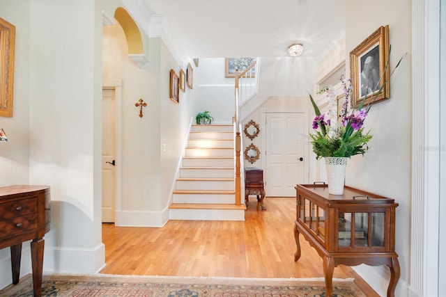 stairway with hardwood / wood-style floors