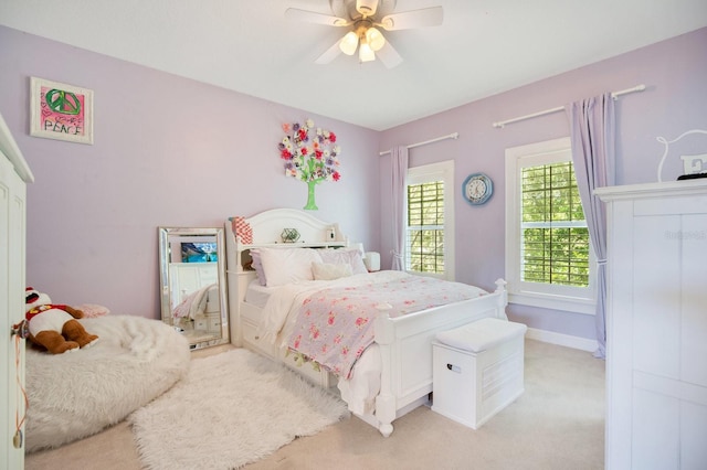 carpeted bedroom featuring ceiling fan