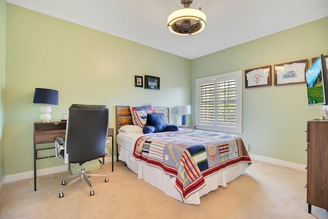 bedroom featuring light carpet and ceiling fan