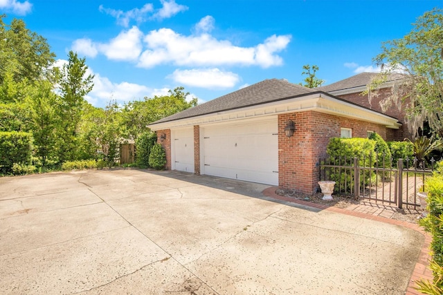 view of side of property featuring a garage