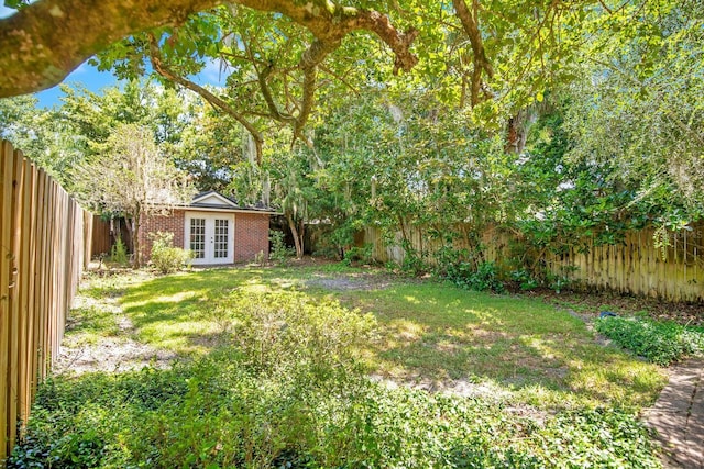 view of yard featuring french doors