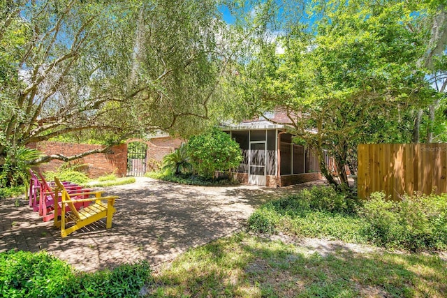 view of yard with a sunroom