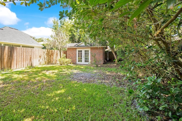 view of yard with french doors