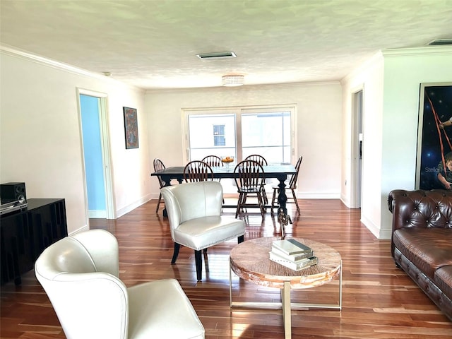 living room featuring a textured ceiling, ornamental molding, and dark hardwood / wood-style flooring