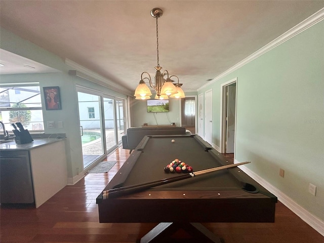 playroom with ornamental molding, pool table, dark hardwood / wood-style floors, and a chandelier