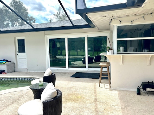 view of patio with a lanai