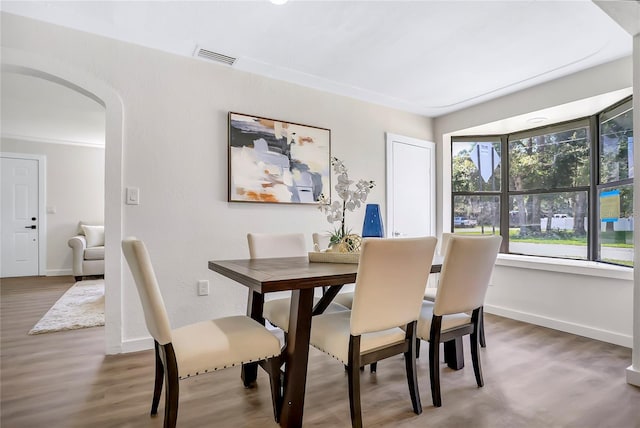 dining area with hardwood / wood-style flooring