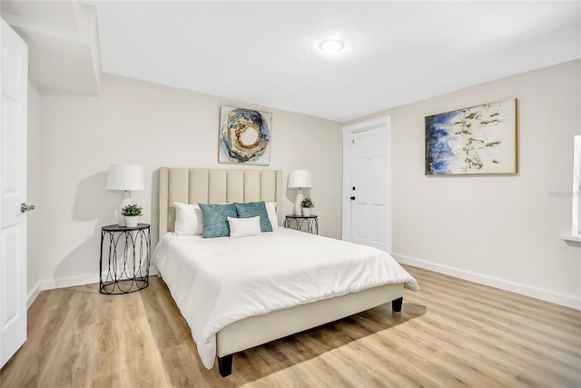 bedroom featuring hardwood / wood-style floors