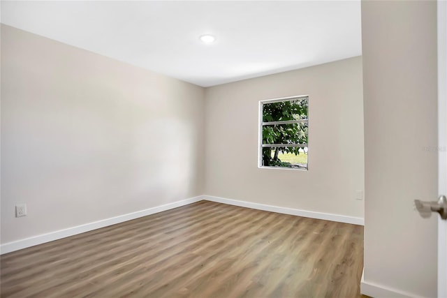 unfurnished room featuring wood-type flooring