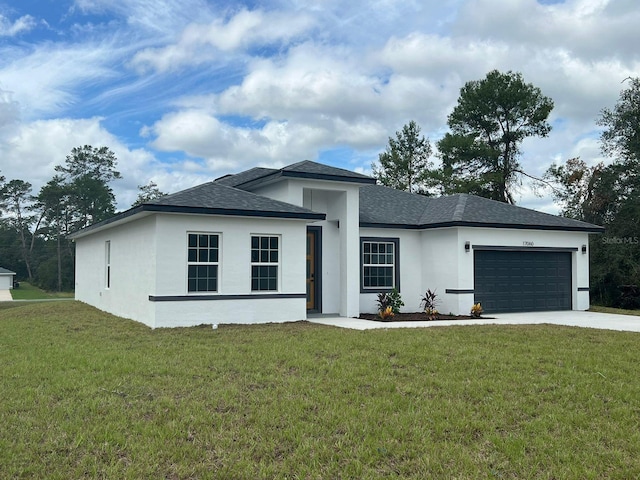 view of front facade with a garage and a front yard