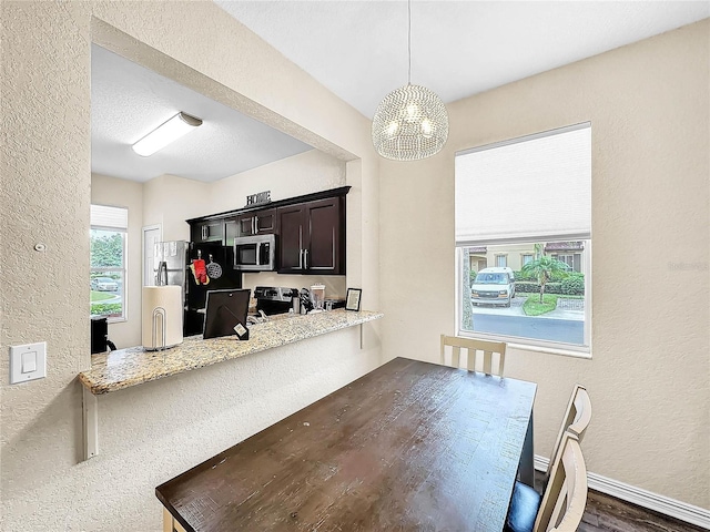 dining area with a chandelier