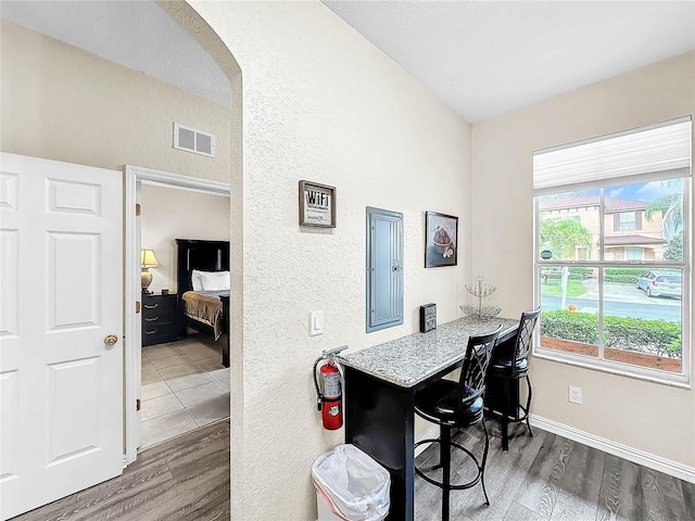 dining area with dark hardwood / wood-style floors