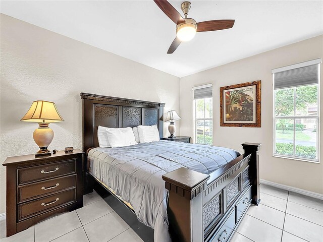 bedroom featuring ceiling fan and light tile patterned floors