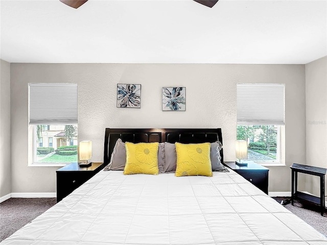 carpeted bedroom with ceiling fan