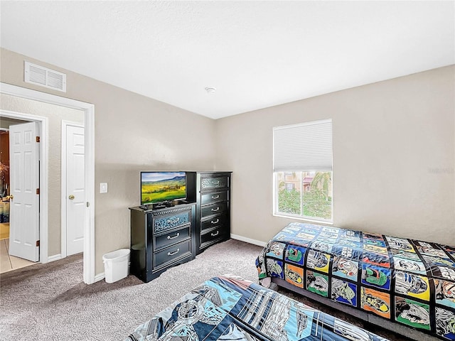 bedroom with light carpet