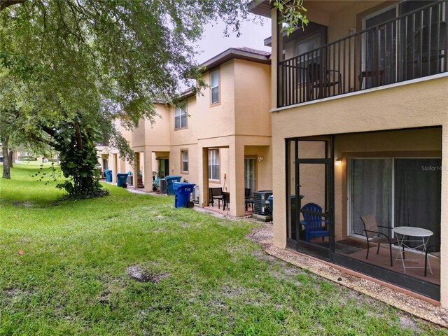 view of yard with a balcony