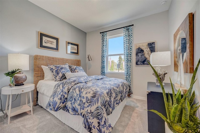 bedroom with light colored carpet