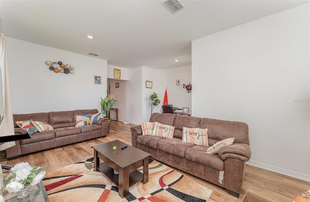 living room with light hardwood / wood-style floors