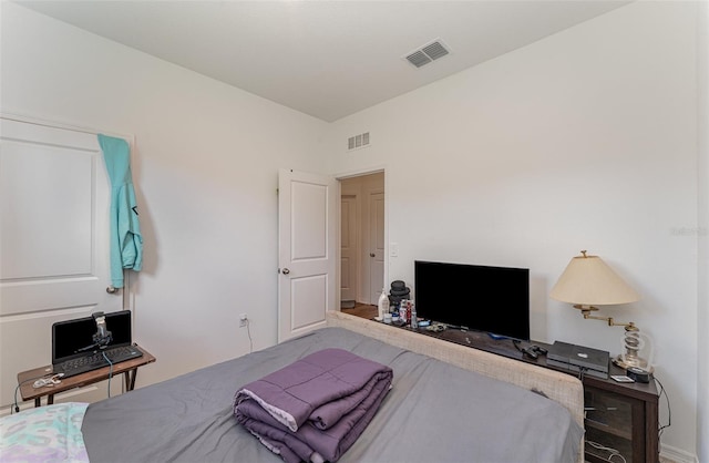 bedroom with wood-type flooring