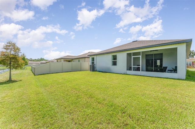 rear view of house with a lawn