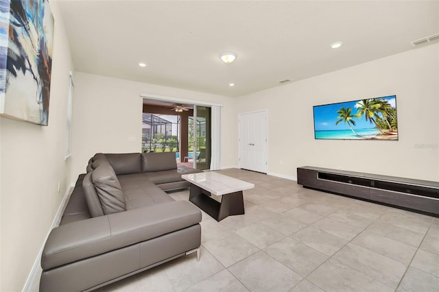 living room featuring light tile patterned flooring and ceiling fan