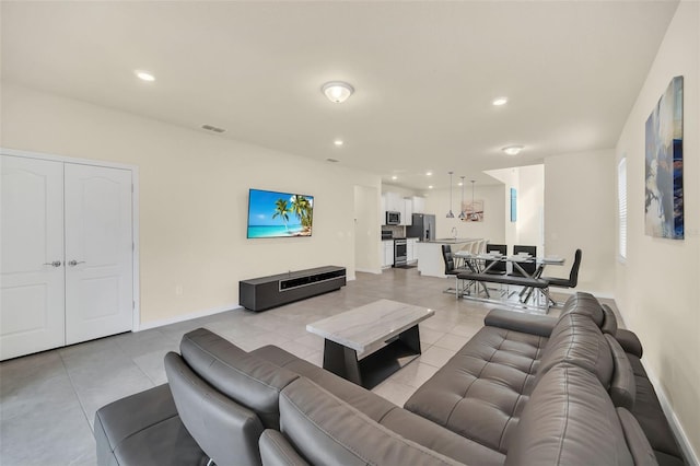 living room with light tile patterned floors