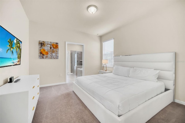 carpeted bedroom with connected bathroom