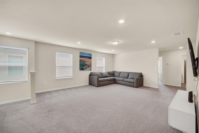 carpeted living room featuring a healthy amount of sunlight