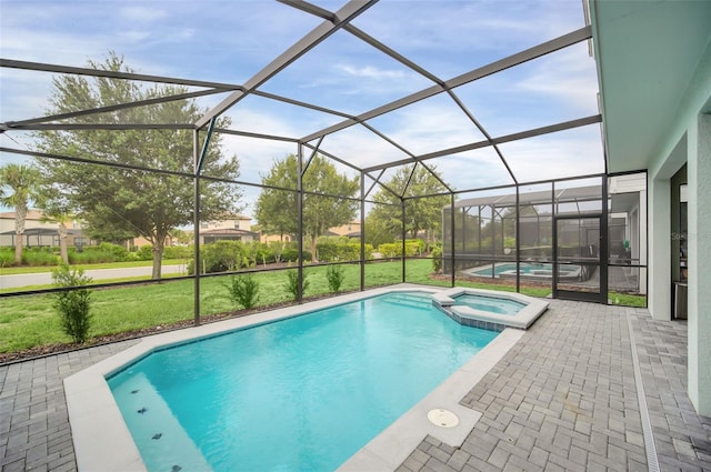 view of swimming pool with a patio, an in ground hot tub, a lanai, and a yard