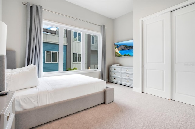 carpeted bedroom with a closet