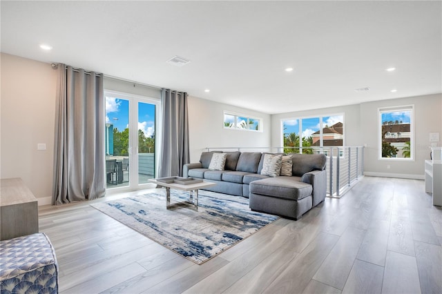 living room with light hardwood / wood-style floors