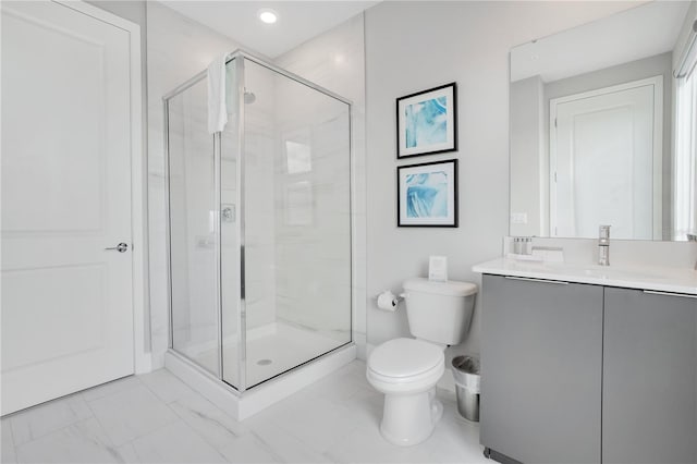 bathroom featuring vanity, toilet, tile patterned floors, and walk in shower