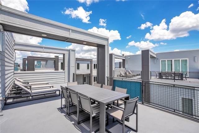 view of patio featuring a balcony