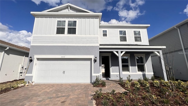 view of front facade featuring a garage and covered porch